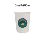 A white disposable paper cup with a printed camping design featuring mountains and a tent.