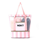 A mesh beach tote bag in pink and white stripes, featuring a transparent compartment and a zippered pocket.