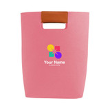 A pink felt tote bag with a tan handle and a multicoloured logo on the front.