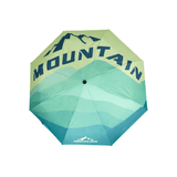 A 21'' automatic compact folding umbrella in green and teal with a mountain design and logo.