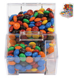 A clear dispenser filled with colorful M&M's in red, blue, green, orange, yellow, and brown.
