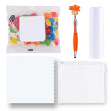 A collection of items including colorful jelly beans, an orange pen, a white lip balm tube, a white pouch, and a cleaning cloth.