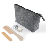 A grey cosmetic pack featuring a zippered bag, a comb, a wooden spatula, and two containers.