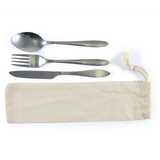 A cutlery set in a calico pouch, including a spoon, fork, and knife. The utensils feature a sleek metallic finish.