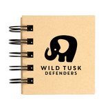 A spiral-bound notebook featuring the logo of "Wild Tusk Defenders," with a graphic of an elephant.