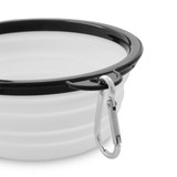 A collapsible bowl in white with a black rim, featuring a metal carabiner for easy attachment.