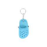 A blue classic clog shoe keyring featuring ventilation holes and a metal chain attachment.