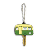 A green and yellow PVC key cover shaped like a vintage caravan, attached to a silver ball chain.
