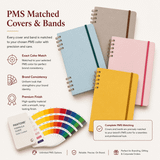 A set of four hardcover notebooks in various colours with matching bands, showcasing a Pantone colour guide.