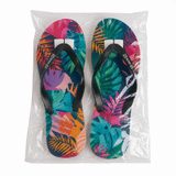 Full colour rubber thongs featuring a vibrant tropical leaf design with black straps, packaged in a clear bag.