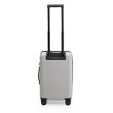 A silver carry-on suitcase with a retractable handle and wheels, featuring a simple design and a logo.