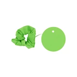 A green scrunchie and a matching round tag are displayed together. The scrunchie has a soft, textured appearance.