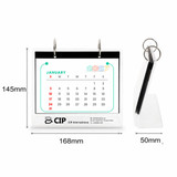 A desk calendar and photo album organiser, predominantly white with colourful elements, featuring a logo and ring binding.