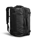 A black backpack with multiple straps, zippers, and a sleek, minimalist design. It features a logo on the front.