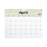 A horizontal wall calendar for April 2027 featuring a floral design in yellow and blue. It has a branded logo at the top.
