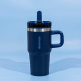 A drink bottle featuring a navy blue exterior, double wall insulation, and a secure lid with a straw.