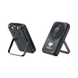 A black wireless power bank with a stand, featuring multiple ports and a charging pad.