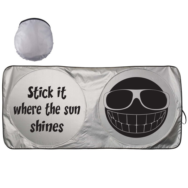 A silver sunshade featuring a smiley face and humorous text, folded in a circular shape. A silver sunshade featuring a smiley face and humorous text, folded in a circular shape.