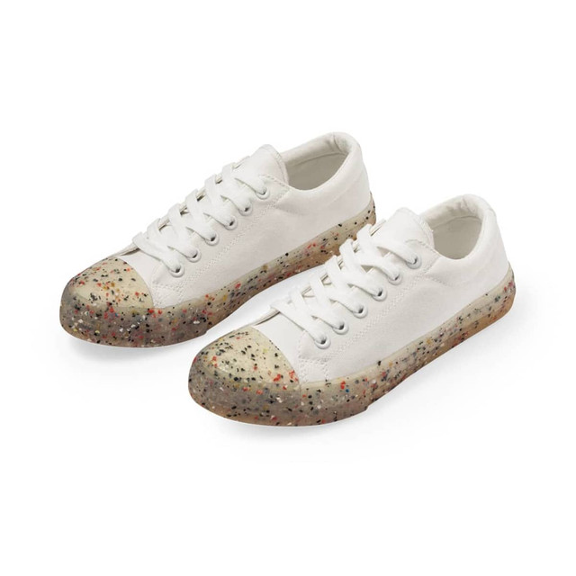 White trainers with a speckled multicoloured sole and a rounded toe, featuring a logo on the side. White trainers with a speckled multicoloured sole and a rounded toe, featuring a logo on the side.