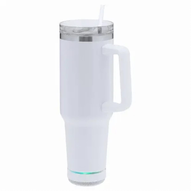 An insulated white mug with a handle, featuring a transparent lid and a built-in speaker at the base.
