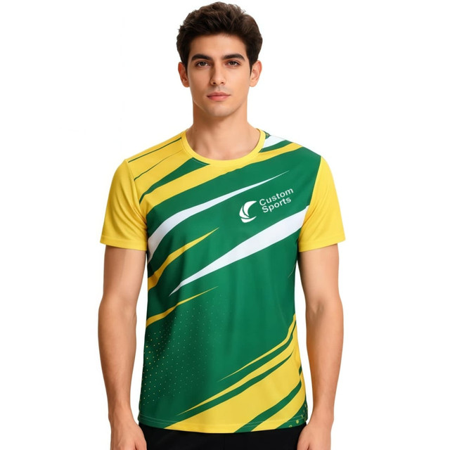 A green and yellow sports tee shirt with a dynamic design and a logo, suitable for uniforms or jerseys.