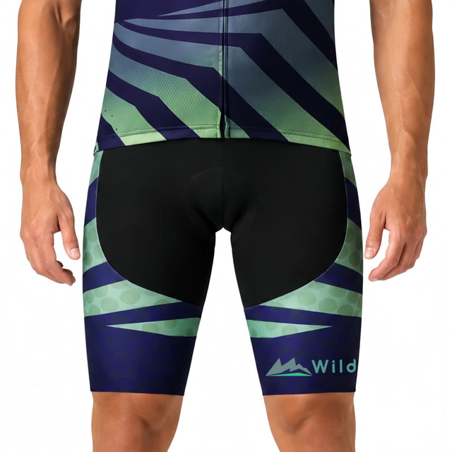 Men's cycling shorts featuring a green and navy sublimated design, with a logo on the side. Suitable for sports uniforms.