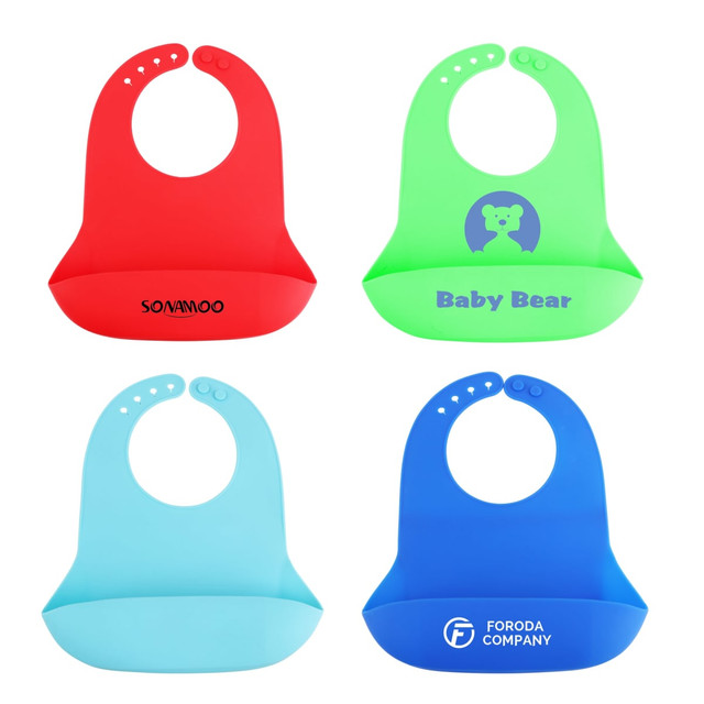 Silicone bibs in red, green, light blue, and dark blue, featuring a logo on the green bib.