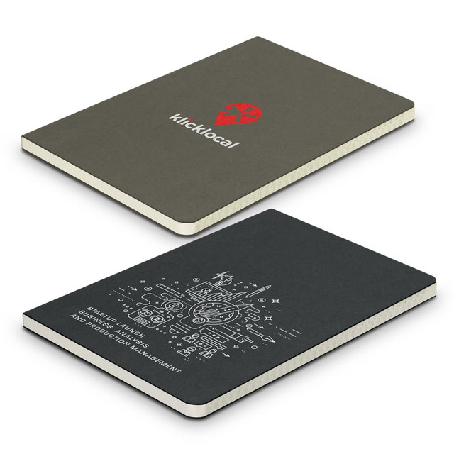 A green recycled cotton soft cover notebook with a logo and a printed design on the front and back.