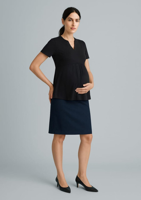 A maternity skirt in navy blue, paired with a black top, displayed on a model. The model is holding her belly.