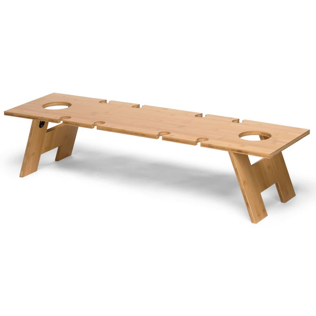 A rectangular wooden table with cut-out sections for drinks, featuring natural wood colour and sturdy angled legs. A rectangular wooden table with cut-out sections for drinks, featuring natural wood colour and sturdy angled legs.