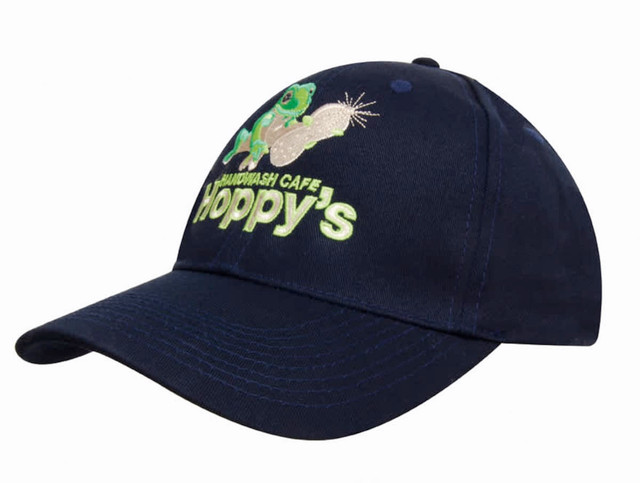 A navy blue twill cap featuring an embroidered design and a logo on the front. A navy blue twill cap featuring an embroidered design and a logo on the front.