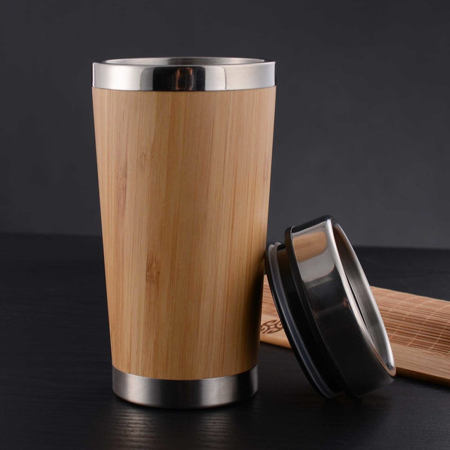 A bamboo mug with a stainless steel base and lid, showcasing a natural wood finish.