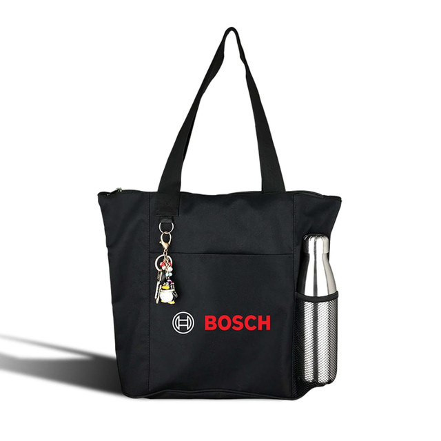 A black nylon shopping tote featuring a side pocket for a drink bottle and a keychain. It has a logo on the front.