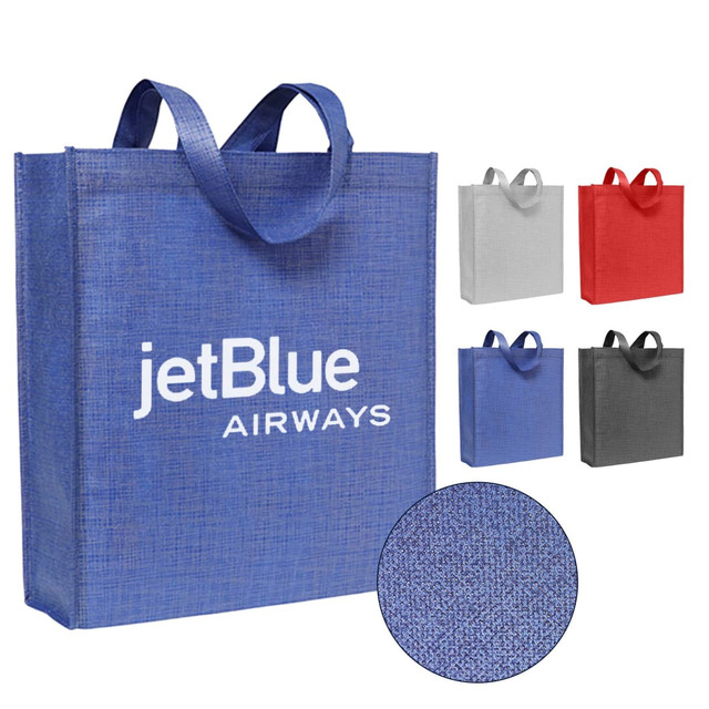 A blue patterned non-woven tote bag with handles and a logo, accompanied by grey, red, and black versions.