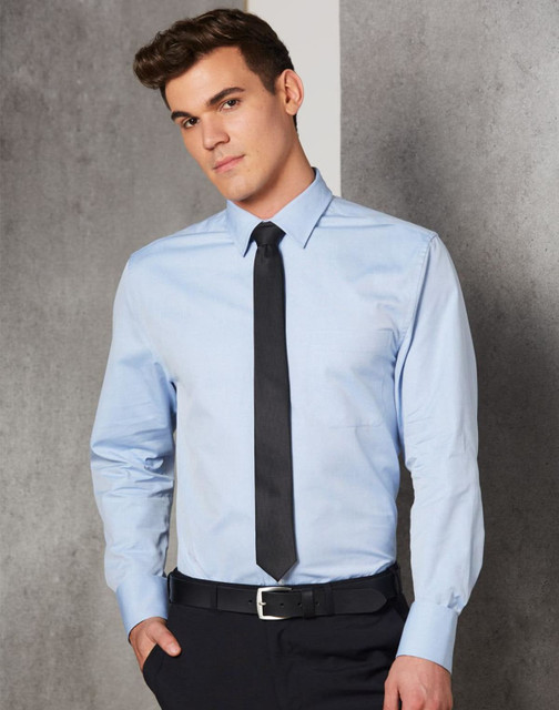 A light blue men's button-up shirt with long sleeves, featuring a collar and a black tie. The model is standing against a neutral background. A light blue men's button-up shirt with long sleeves, featuring a collar and a black tie. The model is standing against a neutral background.