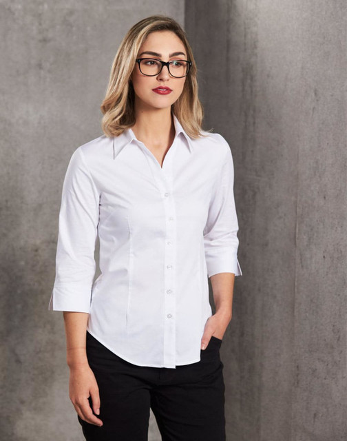 A white women's fine twill 3/4 sleeve button-up shirt, featuring a collar and fitted design. A white women's fine twill 3/4 sleeve button-up shirt, featuring a collar and fitted design.