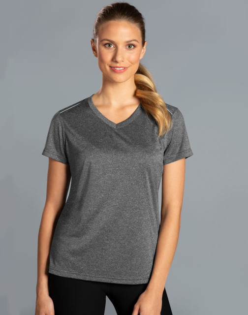 A grey short sleeve tee with a V-neck design, featuring a logo, worn by a smiling woman against a plain background.