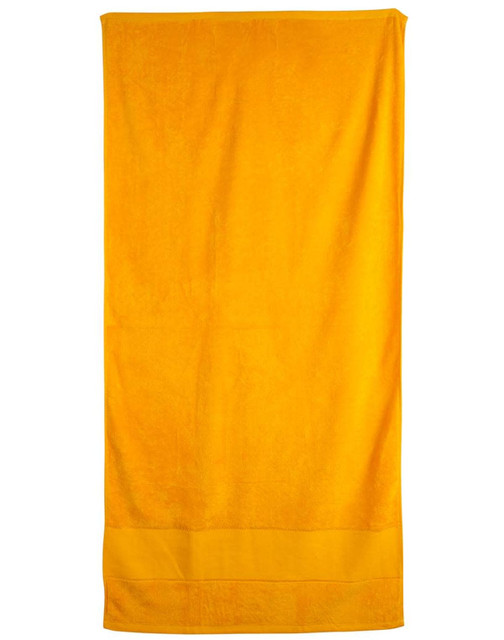 A bright yellow terry velour beach towel, measuring 75x150 cm, featuring a simple design and a logo.