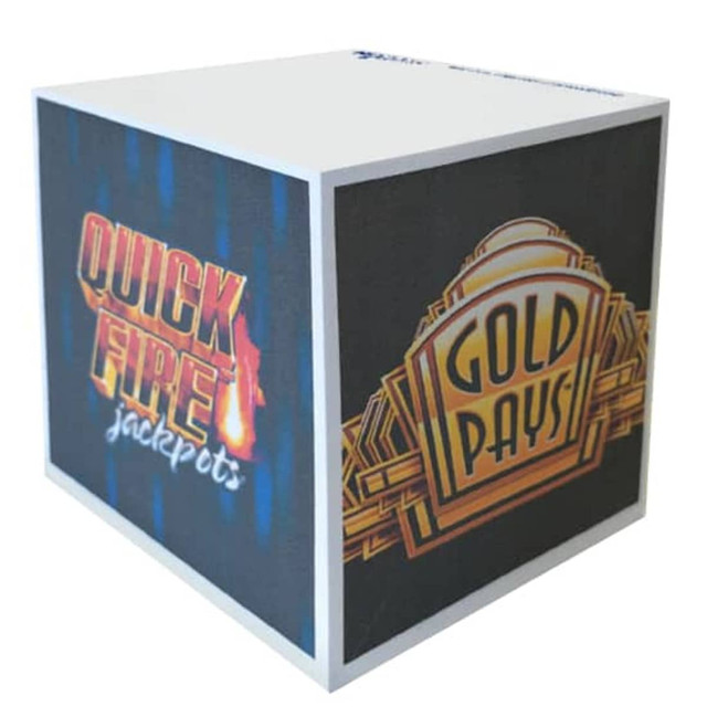 A printed note cube featuring vibrant multi-coloured designs on all sides, including text and logos.