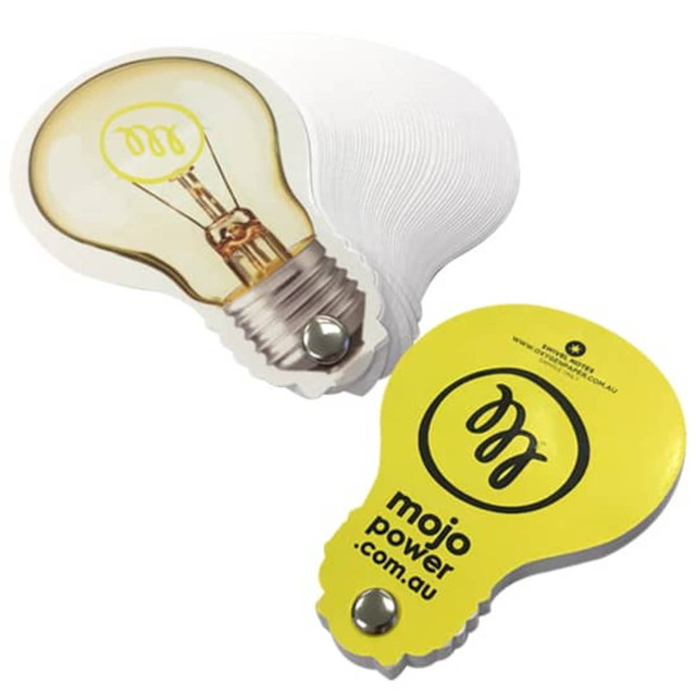 A combo pad in the shape of a light bulb, featuring white pages and a yellow accent, with a logo on one side.