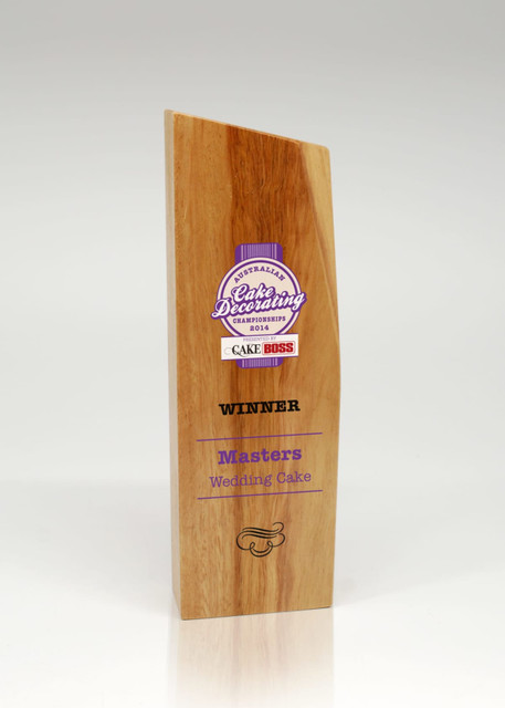 A trophy made of light brown Australian hardwood with a modern design and a logo. A trophy made of light brown Australian hardwood with a modern design and a logo.