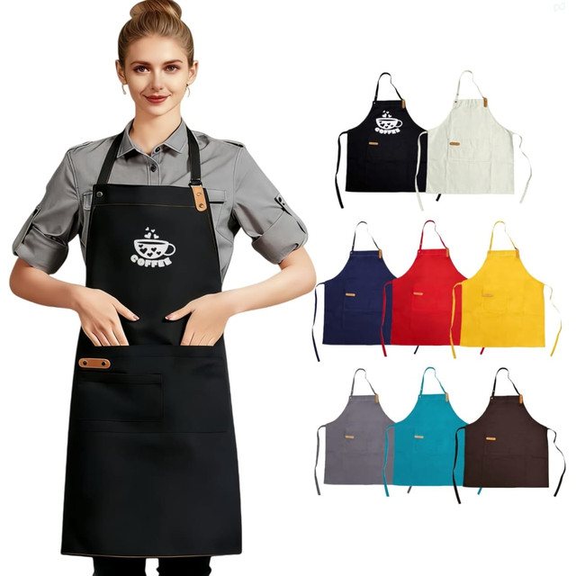 A woman wearing a black poly-cotton canvas bib apron, with various coloured aprons displayed behind her.