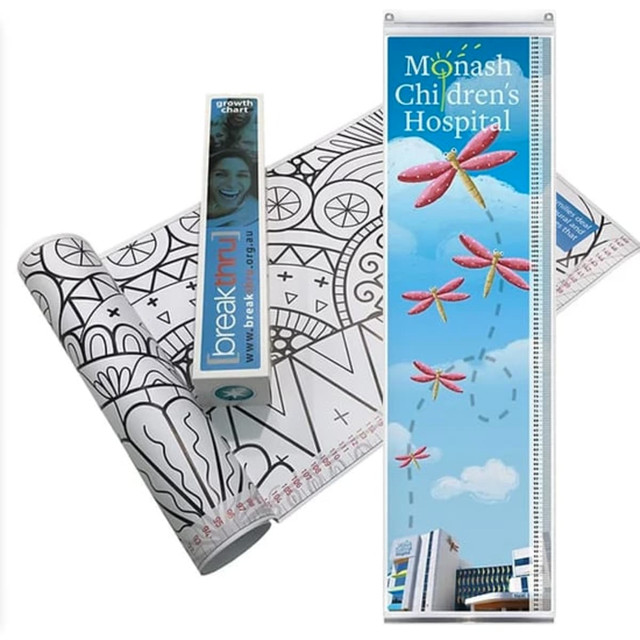 A custom growth chart with a hanger, featuring colourful dragonflies and a black and white design for colouring.