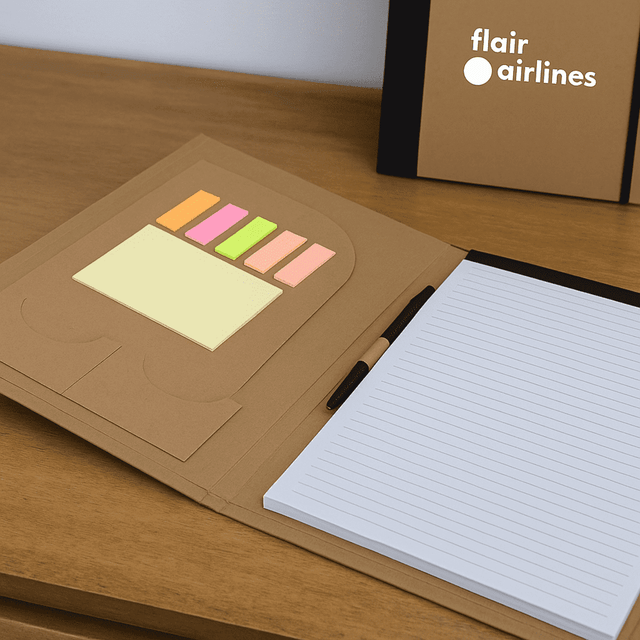 A brown A4 Padfolio featuring sticky notes, a pen, and lined paper inside. Includes a logo and a simple design.