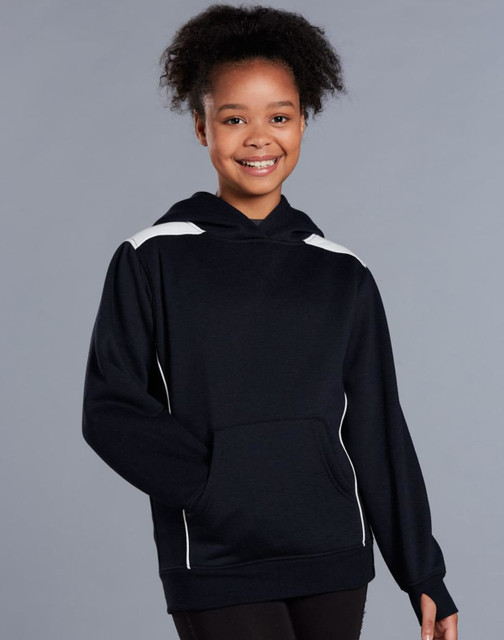 A young girl wearing a navy blue hoodie with white contrast detailing and a kangaroo pocket.