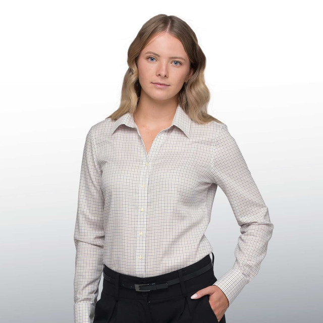 A women's button-up shirt featuring a check pattern, in light colour tones, with a collar and long sleeves. A women's button-up shirt featuring a check pattern, in light colour tones, with a collar and long sleeves.