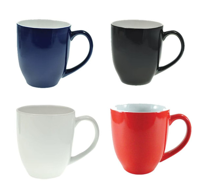 A set of four coffee mugs in navy blue, black, white, and red, each with a handle and a glossy finish.