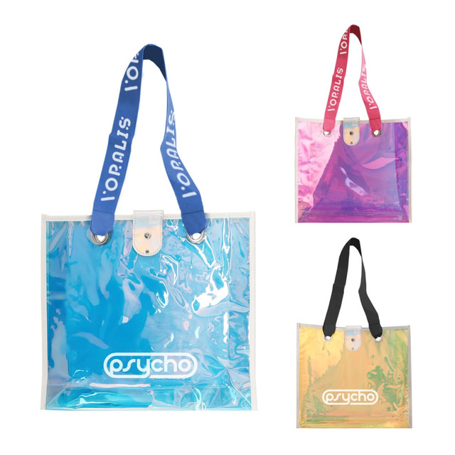 Three iridescent clear tote bags in blue, pink, and yellow, featuring different handle colours and a logo.