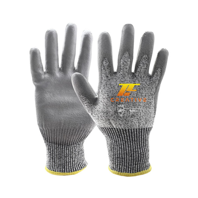 A pair of grey cut-resistant PU gloves with a yellow cuff and a logo on the palm.