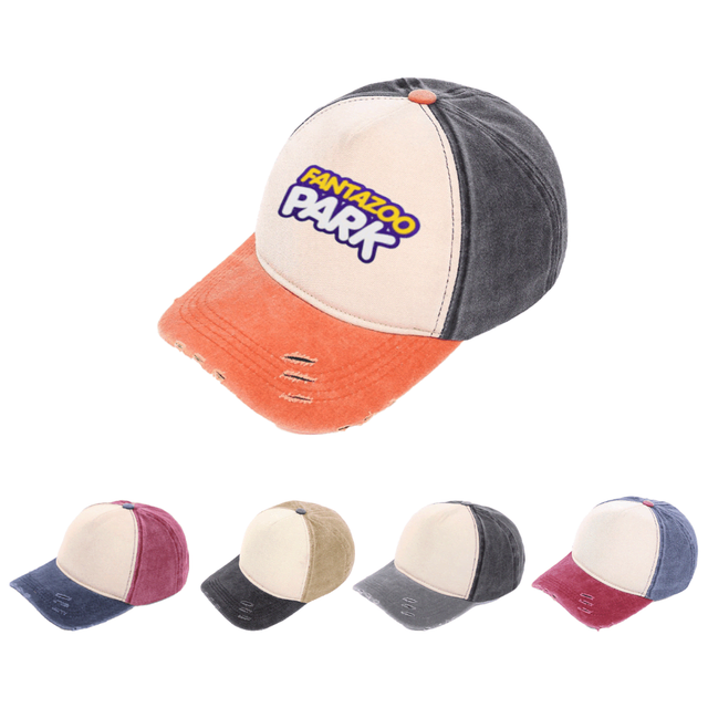 A distressed cotton baseball cap with a cream front, grey sides, and an orange brim. It features a logo.